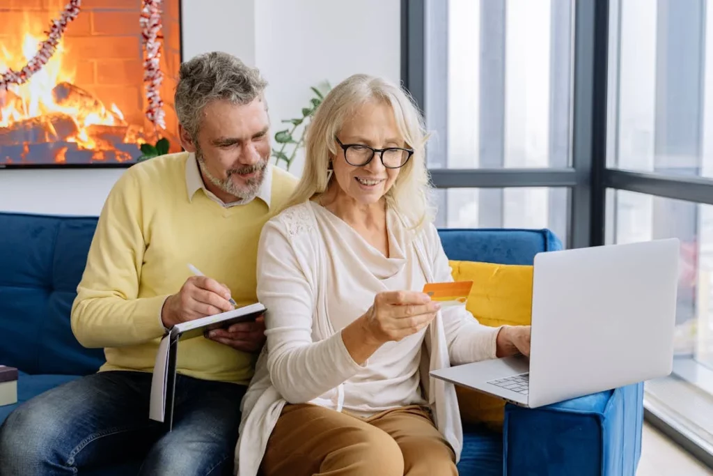 https://www.pexels.com/photo/an-elderly-couple-looking-at-a-bank-card-5810700/